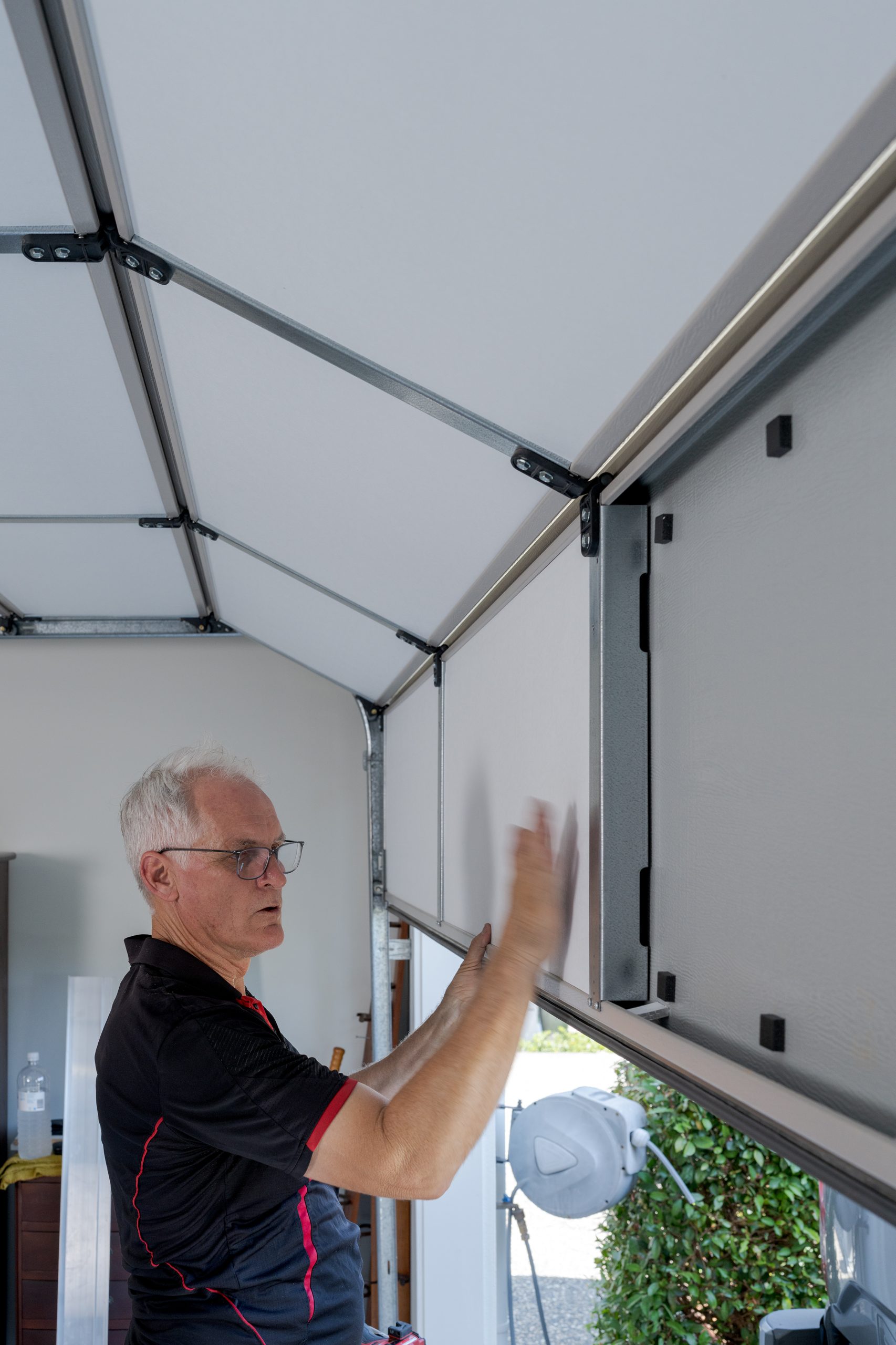 ThermaDoor foam packer spacer system creating air gap between insulation panel and garage door