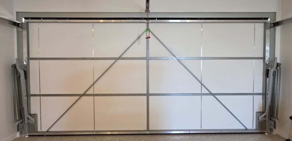 ThermaDoor retrofit garage door insulation installed on an existing tilt garage door
